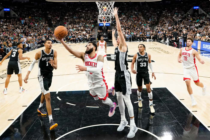 Rockets guard Fred VanVleet dries to the basket past San Antonio Spurs center Zach Collins during the second half at Frost Bank Center.
